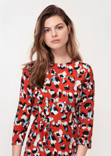 3/4 sleeve dress with asymmetric hem in a Red animal print