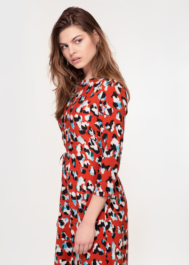 3/4 sleeve dress with asymmetric hem in a Red animal print