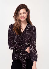 Long sleeve, V neck tie front top in Black and white sketch floral print