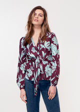 Long sleeve, V neck tie front top in purple and turquoise snake print