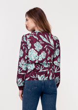 Long sleeve, V neck tie front top in purple and turquoise snake print